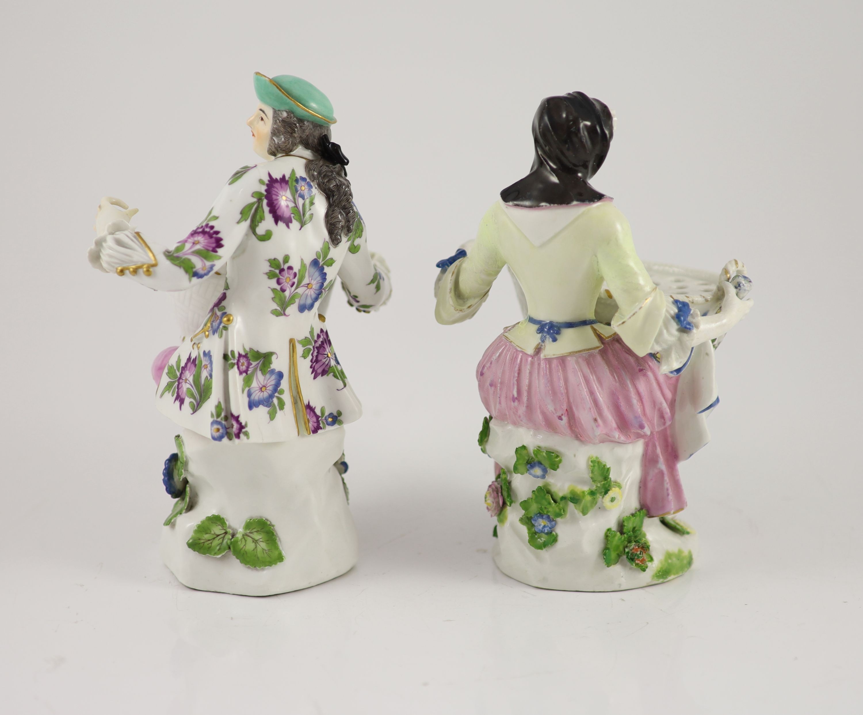 A pair of Meissen figural flower holders c.1755, 20cm and 19.5 cm high, restoration